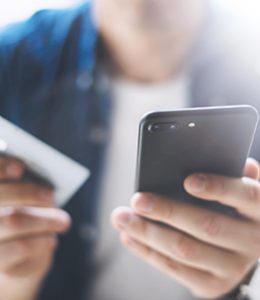 Image of Person Using Their Phone for Online Banking